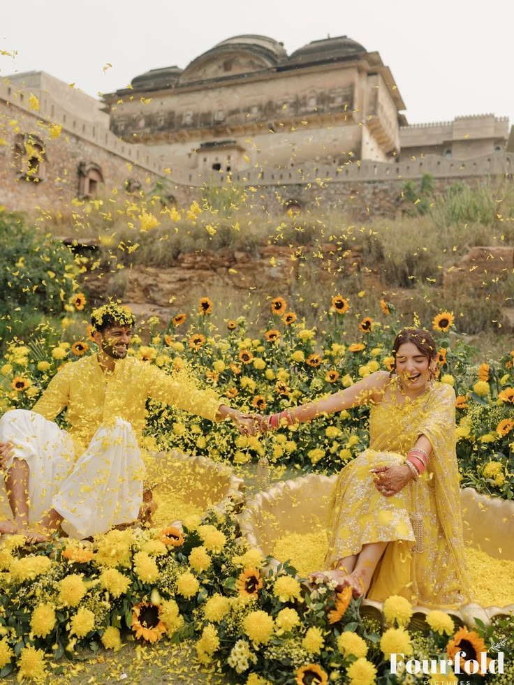Seven married women preparing turmeric for the Mangan ceremony